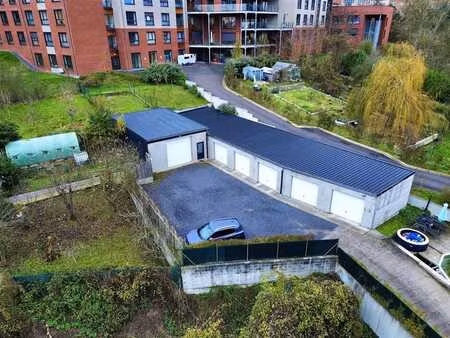 ensemble immobilier polyvalent (garages + entrepot+ terrain)