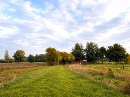 uniek perceel bouwgrond te koop in een groene omgeving me...