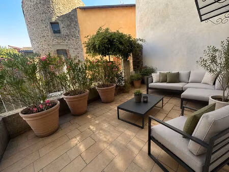 centre bourg  t-2 avec terrasse sur grezieu la varenne