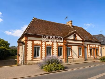 immeuble de 250 m² de plancher sur 1000 m² de terrain