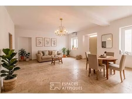 appartement rez-de-jardin avec patio privé et garage au centre-ville