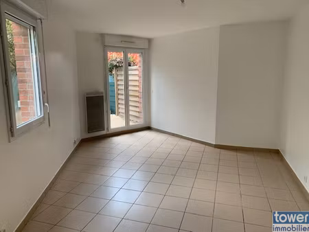 rez-de-jardin avec jardin privatif + parking opportunité r