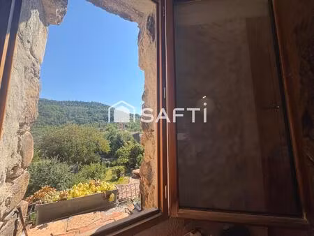charmante maison   la pierre apparente et un calme absolue