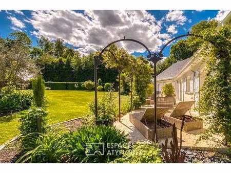 élégante maison de plain-pied avec jardin paysager et double garage