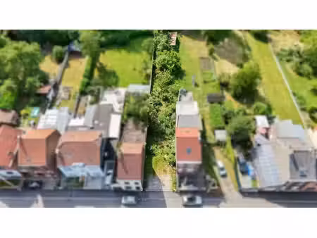 beau terrain à bâtir de 6 ares avec plus de 3 ha en option