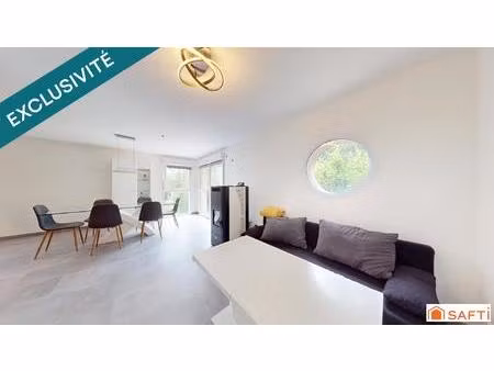 duplex avec jardin privatif  garage double  faibles charges et cadre verdoyant.