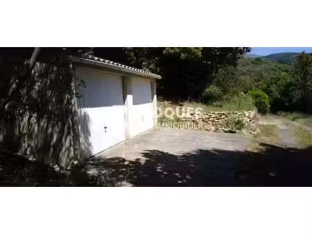 a vendre  premian  2 garages plus jardin