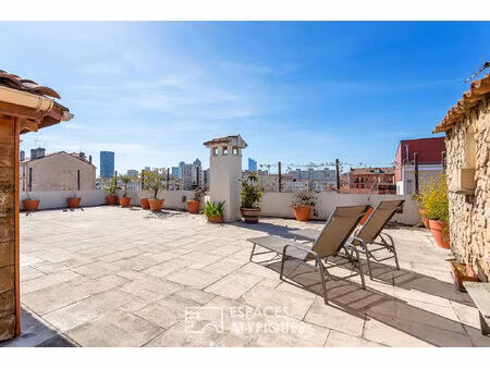 aux portes du 6ème : appartement rénové en dernier étage avec une terrasse plein ciel de 1