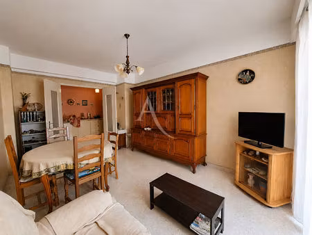 appartement 4 pièces-centre-ville- traversant- parking s/s -cave