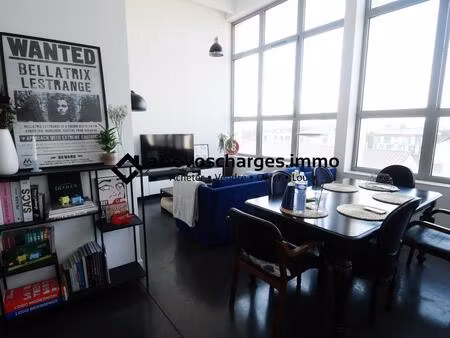 loft 64 m² avec parking et balcon