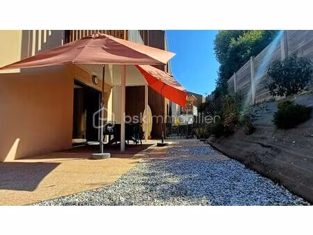 a vendre - bel appartement récent 3 pièces en rez-de-chaussée avec un vaste extérieur au c