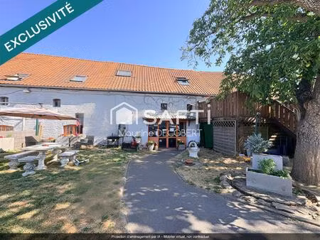 ensemble immobilier comprenant 1 local commercial et un appartement sur un axe principal
