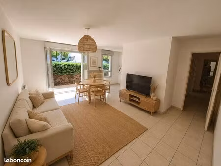 appartement 60m² sécurisé rdc proche tram/ikea avec terrasse et parking box fermé