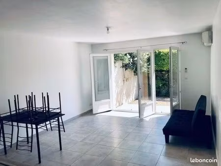grand t2 + clim +jardin+terrasse+parking