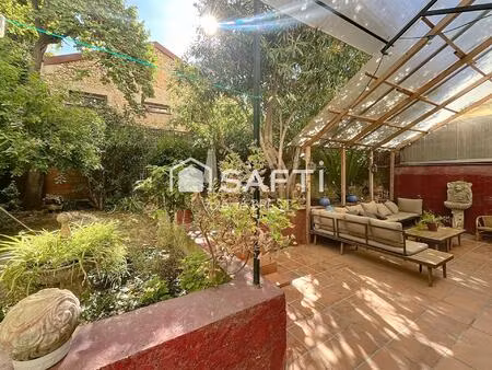 bail a céder -local plus appartement -jardin de 200m2.