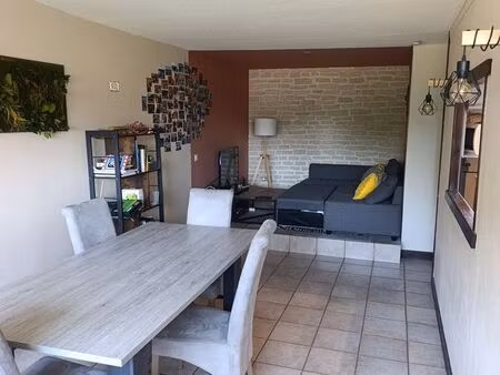 appartement traversant 67 m² + garage en box + cave