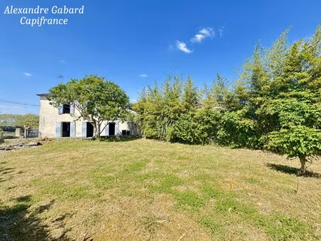 maison en pierres - 3 chambres - jardin - garage et fort potentiel