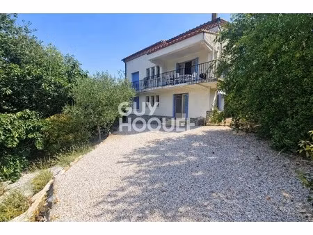 maison 4 faces avec garage et jardin