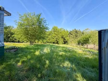à vendre : maison 3 façades à rénover sur un vaste terrai...