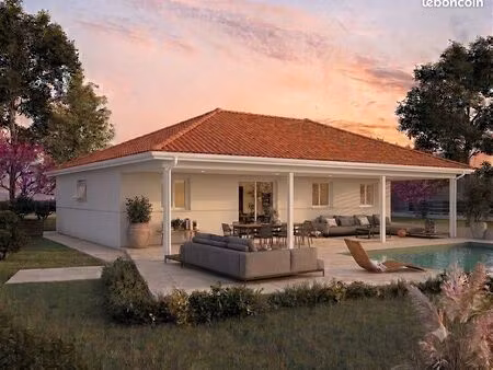 très grande terrasse couverte trois chambre plus garage en plein centre ville de belin-bel