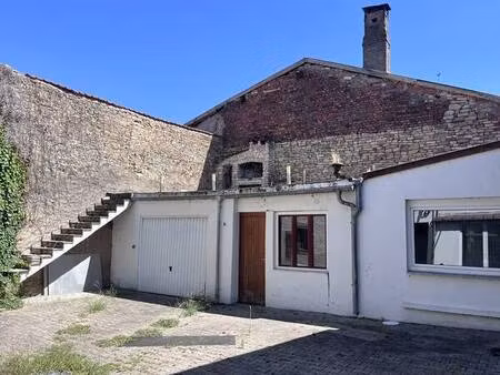 immeuble : 1 appartement 1 local commercial 1 garage 2 ateliers.