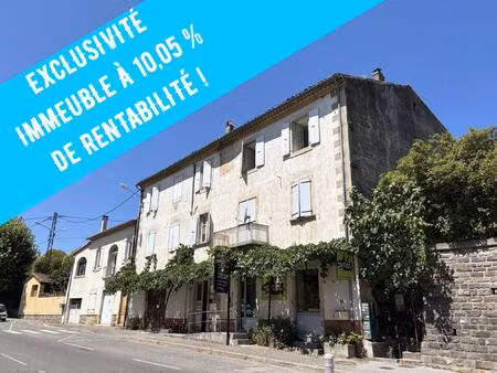 immeuble de rapport comprenant 4 appartements et 1 local commeci