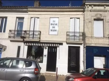immeuble (appartement +local magasin)