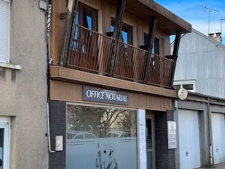 immeuble/maison de ville comprenant appartement + local loué jardin+garage