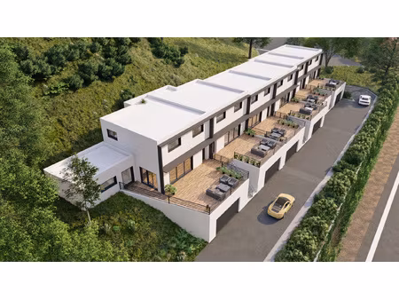 terrain plein centre de 1000m2 avec permis obtenu pour 3 vil