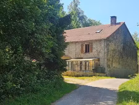 maison de caractère en pierres  dépendances et terrain de 1 36 ha avec source
