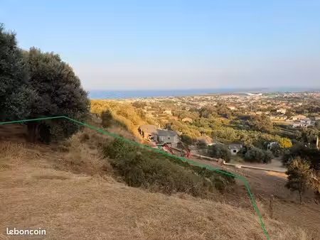 hauteurs d’agliani - vends terrain constructible avec vue dégagée sur la mer et l’étang de