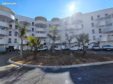 t3 neuf 60m² + grand balcon 21 m² + parking intérieur