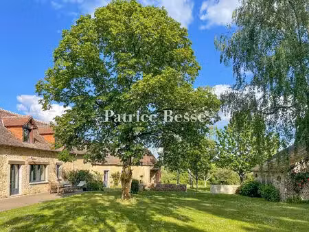 à 200 km de paris  dans le perche sarthois  une ancienne ferme restaurée sur plus d'1 ha .