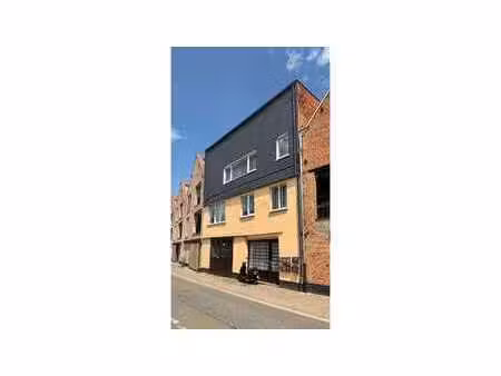 opbrengsteigendom met 7 appartementen + ruime garage-maga...