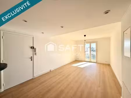 t3 traversant de 68 m2 - balcons - garage et cave