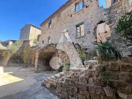 maison en pierre à vendre aux assions. proche les vans. charme authentique  dépendances et