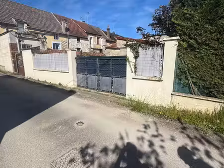 vends garage avec terrain transformable en habitation