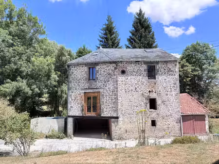 superbe moulin rénové dans un cadre enchanteur