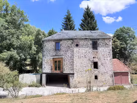 superbe moulin rénové dans un cadre enchanteur