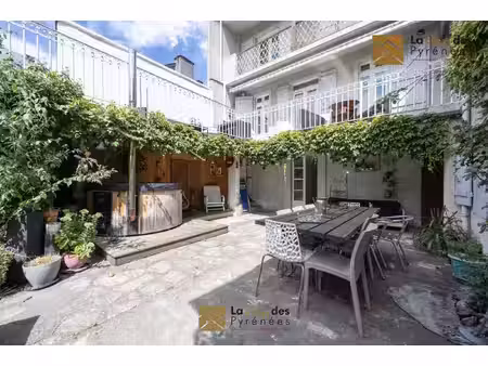 demeure familiale ave jardin et revenu locatif