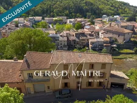 maison de village 5 ch avec jardin et garage  vue sur la rivière.