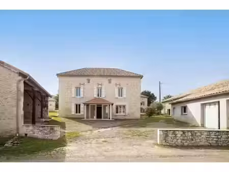 country property with numerous outbuildings