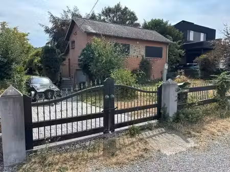 maison avec magnifique jardin et garage à vendre