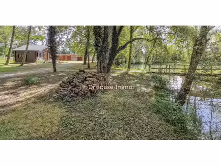 écurie  avec chalet  hangar  étang et terrain de 1 hectare