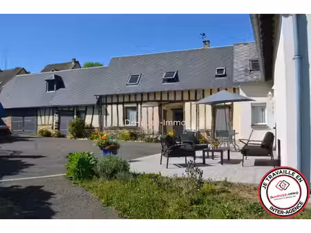 a vendre grande maison dans un village proche de bernay et de toute les commodités à pied