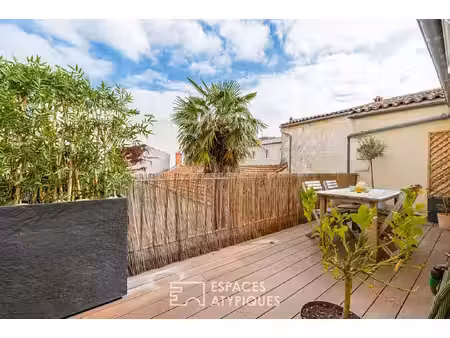 appartement avec terrasse et finitions soignées proche du marché