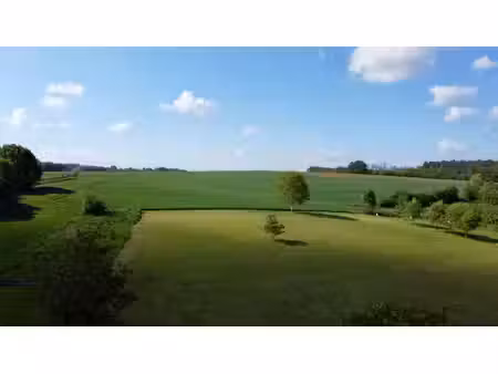terrain avec vue imprenable à néthen  au calme !