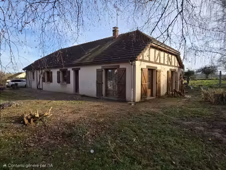 maison de plain pied  trois chambres avec terrain et garage.