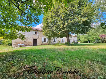 magnifique longère en pierre  dépendances et plus de 2.7ha de terrain – charme et...