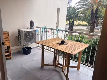 appartement avec balcon et parking privatif - rive gauche du